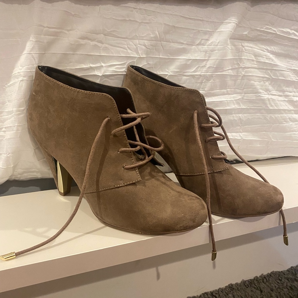 Brown booties with gold accents